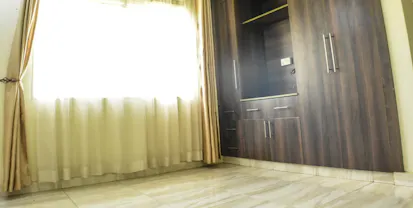 Interior view with wood flooring and ceiling in Exclusive Kololo Address apartment, KololoIii, Kampala